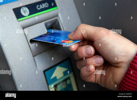 Insert Credit Card Into An Atm Machine Stock Photo Alamy