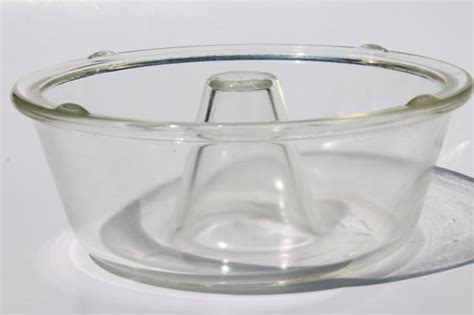 Inspired by the gorgeous stained glass widows of a cathedral or palace, this intricate tube pan will elevate any basic cake or bread dish into an ornate piece of art. vintage Glasbake glass angel food cake / bundt pan, heat ...