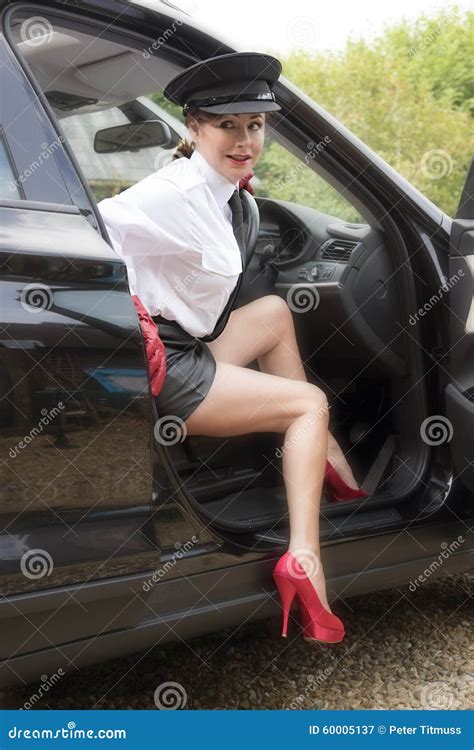 Woman Chauffeur With Sexy Legs Stock Image 60005209