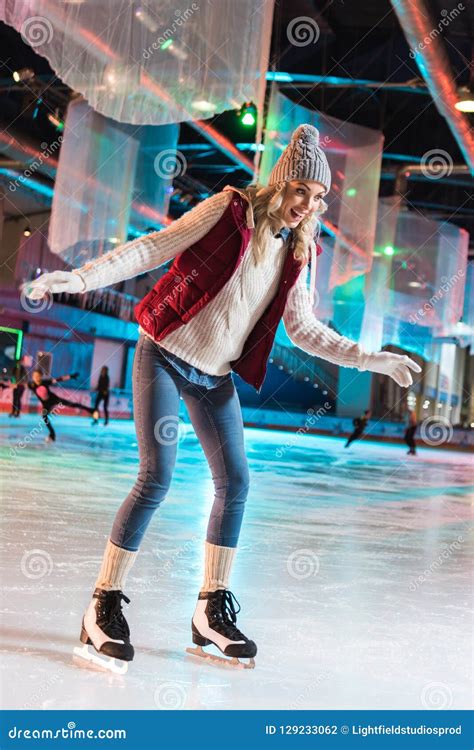 Excited Beautiful Young Woman Ice Skating Stock Photo Image Of Season