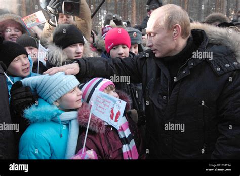 President Vladimir Putin meeting with children outside the home of 