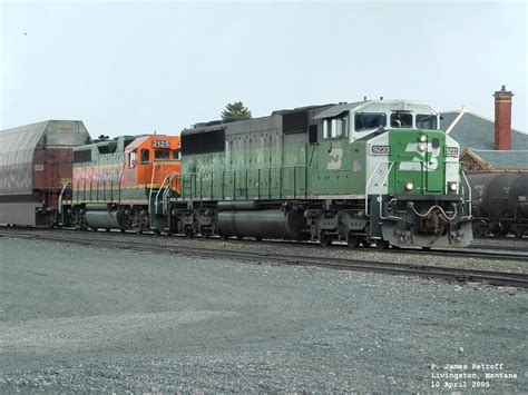 Bnsf 9233 Sd60m And Bnsf 2125 Gp38ac Waiting For Eastbound To Pass
