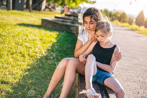 Girl Comforting Her Sad Friend Stock Photo Image Of Bench Helping