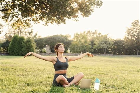 Yoga Meditation Online With Laptop On The Grass In Green Park Fit Girl Training Outdoor