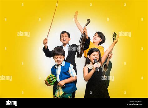 Kids And Music Concept Cute Little Indian Kids Playing Musical