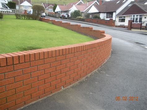 Red brick wall and posts with black railings and cast iron gate in front garden. CWM LLYNFI BRICKLAYING : 9 INCH RED FACE BRICK GARDEN WALL ...