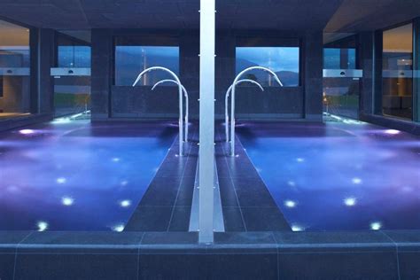 Outdoor Vitality Pools With Swan Neck Fountains At The Europe Hotel