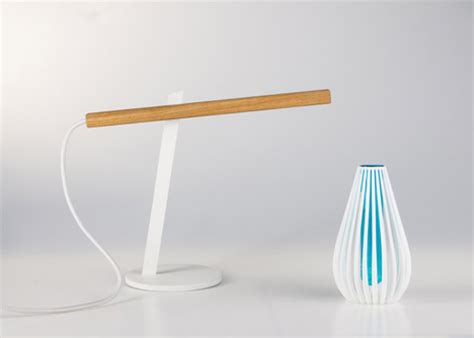 This magnetic force then turns the lamp on. Magnetic Desk Lamp Goes Two Pieces for Illumination | Designs & Ideas on Dornob