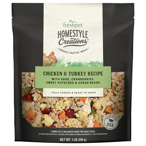 Woman handing dog a bowl of dog food. Freshpet Homestyle Grain-Free Creations Chicken and Turkey ...