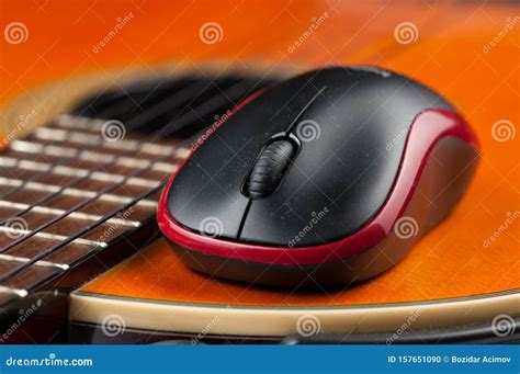 Computer Mouse And Guitar Isolated On White Background Stock Photo