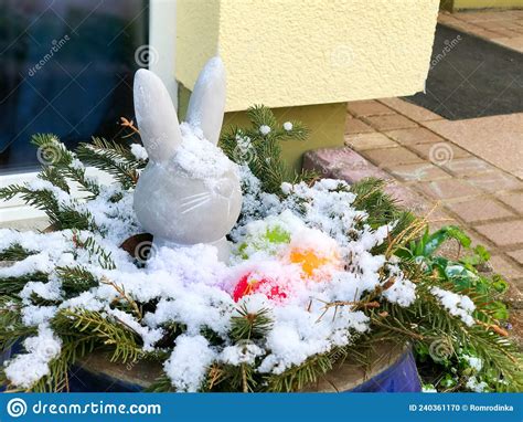 Easter Outdoors Decoration Covered With Snow Easter Bunny And Colored