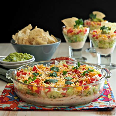 In a small bow, mix together the refried beans and taco seasoning. Layered Mexican Dip - Simply Sated