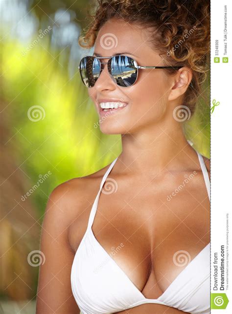 Bikini Girl Wearing Sunglasses On Palm Tree Royalty Free