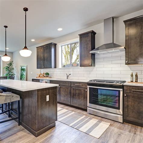 In fact, black kitchen cabinets are popular… but not as popular as deep, rich dark wood kitchen cabinets. Brown and White Kitchen | Dark wood kitchen cabinets ...