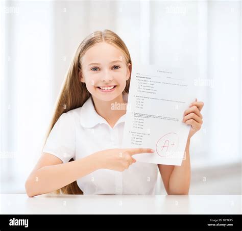 Girl With Test And Grade At School Stock Photo Alamy