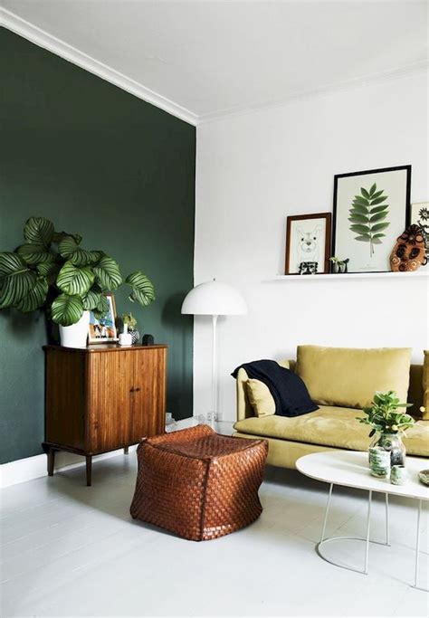 Larger living rooms with high ceilings and an open floor plan look beautiful with walls painted in lighters tones of the color. 15 Photos Green Wall Accents