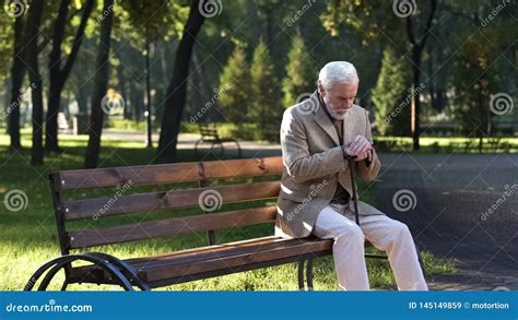 Lonely Upset Old Man Sitting Alone In Park And Thinking About Life