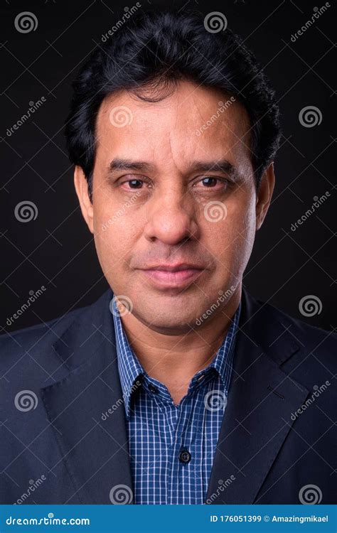 Portrait Of Mature Handsome Indian Businessman In Suit Stock Image