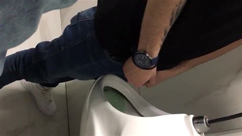 shaking his thick cock at urinal