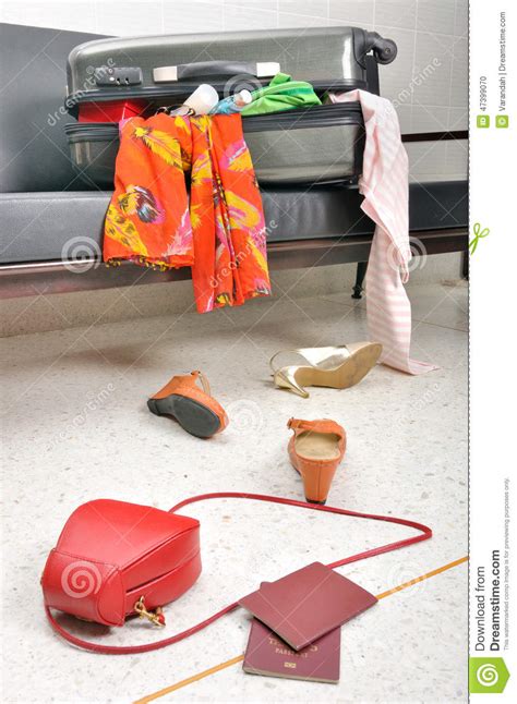 Stuff And Clothes Travel Suitcase Scattered In Sofa Stock Photo Image