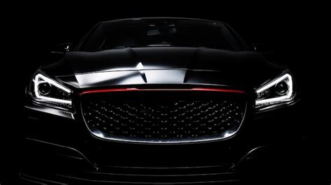 Premium Ai Image A Black Car With The Headlights Lit Up In A Dark Room