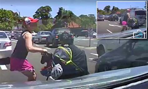 woman pushing a pram is almost hit by car as she tries to cross seven lanes in sydney daily