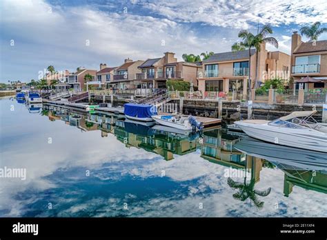 Amazing waterfront landscape with houses docks and boats under cloudy