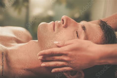 Handsome Man Having Massage In Spa Salon Photo Libre De Droits Sur La