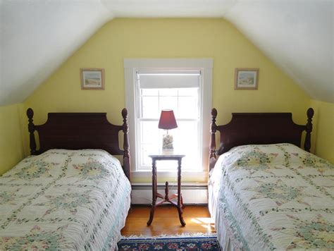 Items with simple lines and solid shapes and even featuring distressed finishes will do the job. A cozy yellow Cape Cod bedroom. | Attic remodel, Attic ...