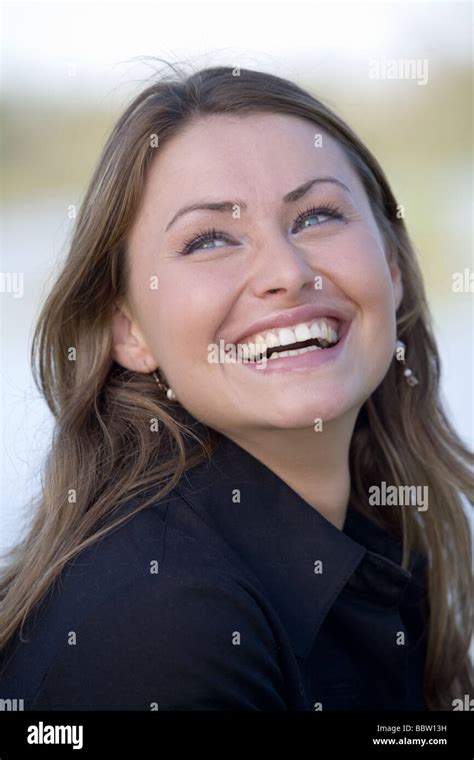 Attractive Young Woman Laughing Out Loud Stock Photo Alamy