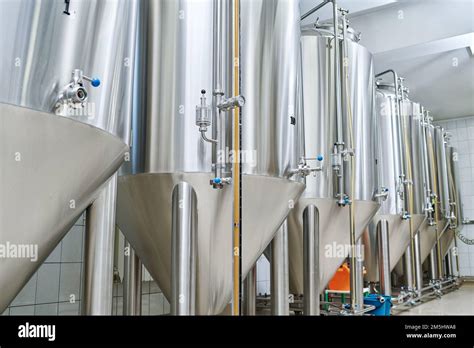 Stainless Steel Tanks For Brewing Drinks Standing In A Row In Storage