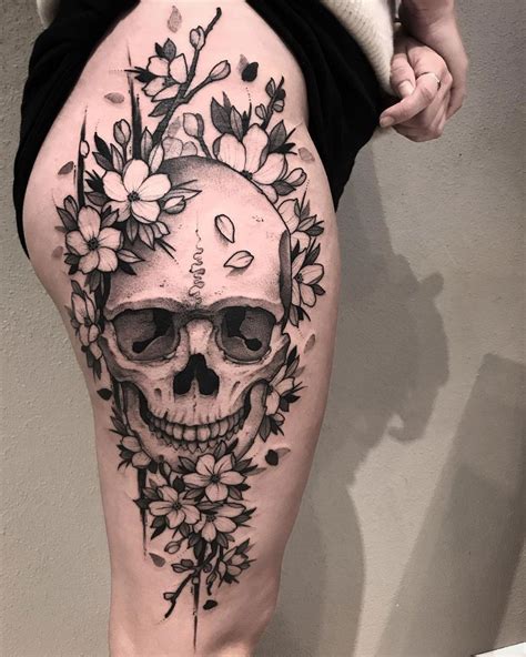I've seen some beautiful ones lately. Skull & Flowers https://tattoo-ideas.com/skull-thigh ...