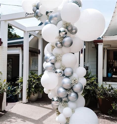 Making An Entrance With This White Balloon Garland At Beach Byron Bay