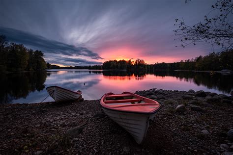 Boat On Coast Sunset By Mikael Järnåsen