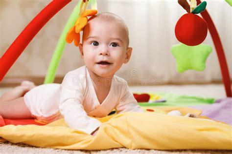 Cute Baby Is Playing On The Activity Mat Stock Photo Image Of Small