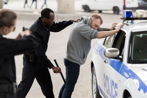 Police Officers Arresting Someone