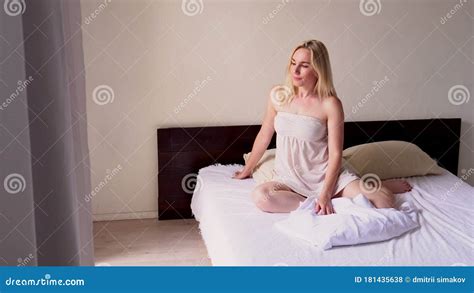 Beautiful Blonde Woman Wakes Up After Sleep In The Bedroom On The Bed Stock Footage Video Of