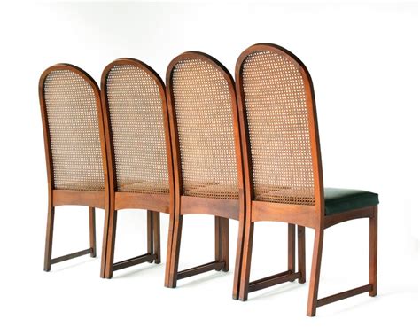 These oval rattan backs and carved frames are classics. Milo Baughman Oval Back Cane Dining Chairs For Sale at 1stdibs