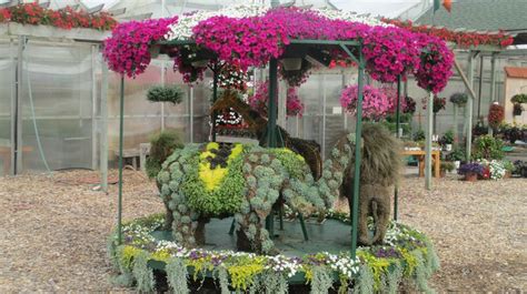An Elephant Made Out Of Flowers In A Greenhouse