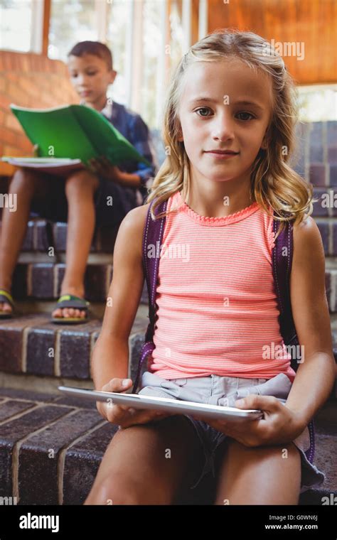 Cute Little Schoolgirl With Her Digital Tablet Stock Photo Alamy