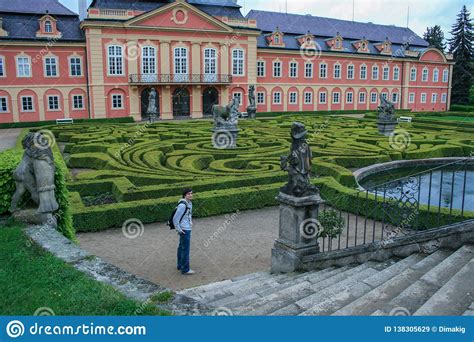 Statues Of French Garden Of The Dobris Chateau Tourist On Background