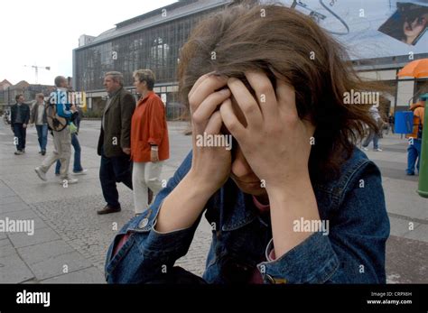 Desperate Woman Hides Her Face Berlin Stock Photo Alamy