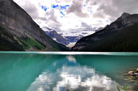Rocky Mountains Reflected On Lake Louise Blue Water Photograph By Eddy