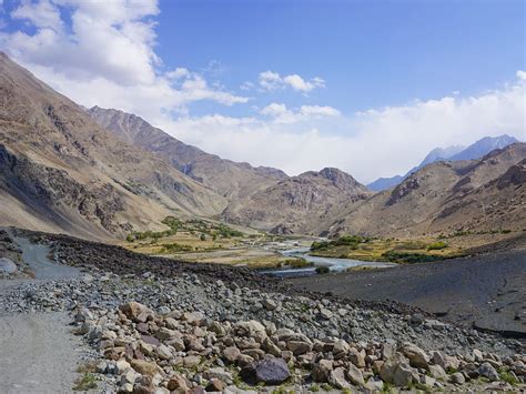 An afghan national army soldier surveying atop a humvee; Hidden Wakhan: a trek through Afghanistan's Pamir ...