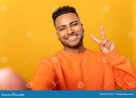 Happy Satisfied Man Showing V Sign Symbol Of Peace With Fingers Looking At Camera With Toothy