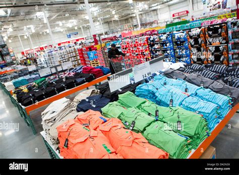 Customers Shopping In The Clothing Section Of A Costco Wholesale Stock