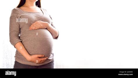 Pregnant Woman With Big Belly At Window Maternity Prenatal Care And