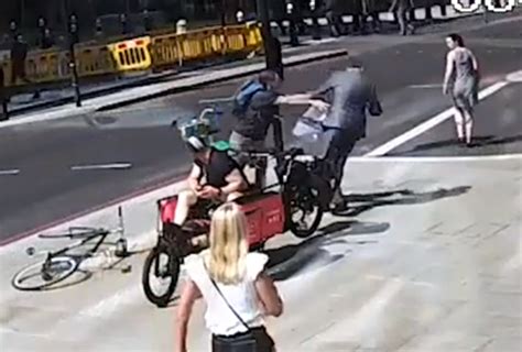 Moment Cyclist Headbutts City Worker To The Ground After Near Miss On