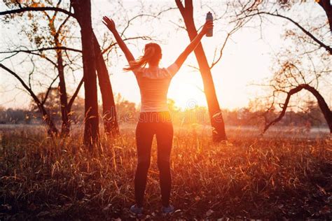 Runner Raised Arms After Workout Feeling Free And Happy Succeeded In