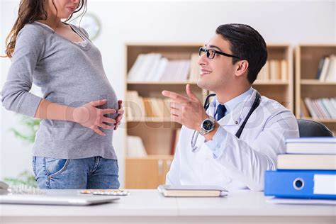 Pregnant Woman Visiting Doctor For Consultation Stock Image Colourbox